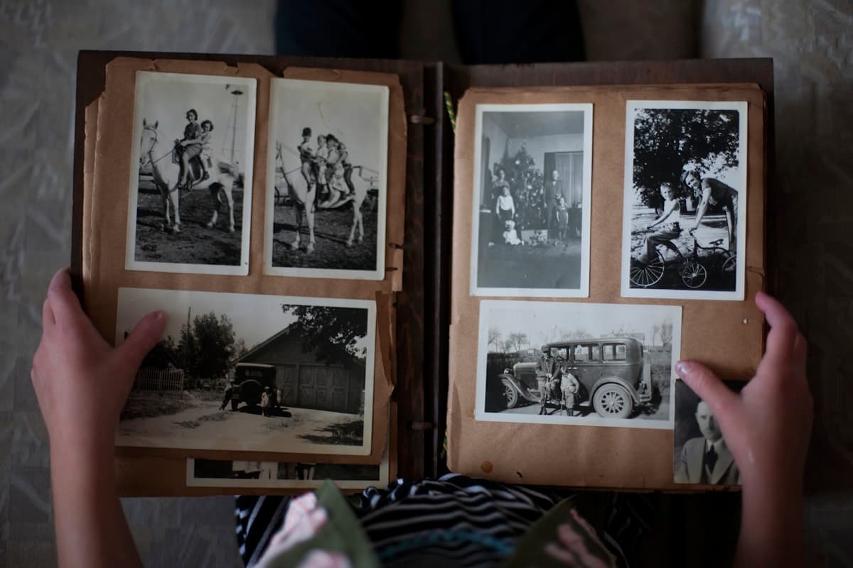 An open family photo album on a table